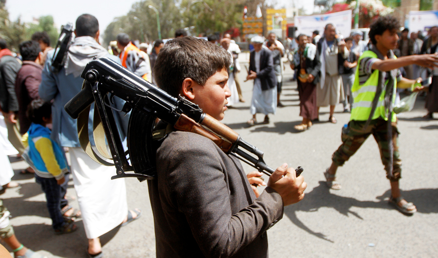 A boy carries a weapon as he and Houthi supporters are seen during a gathering in Sanaa, Yemen April 2, 2020. (REUTERS)