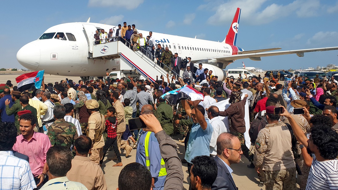Crowds gathered on the runway as the passengers started to come off. (AFP) Crowds gathered on the runway as the passengers started to come off. (AFP)