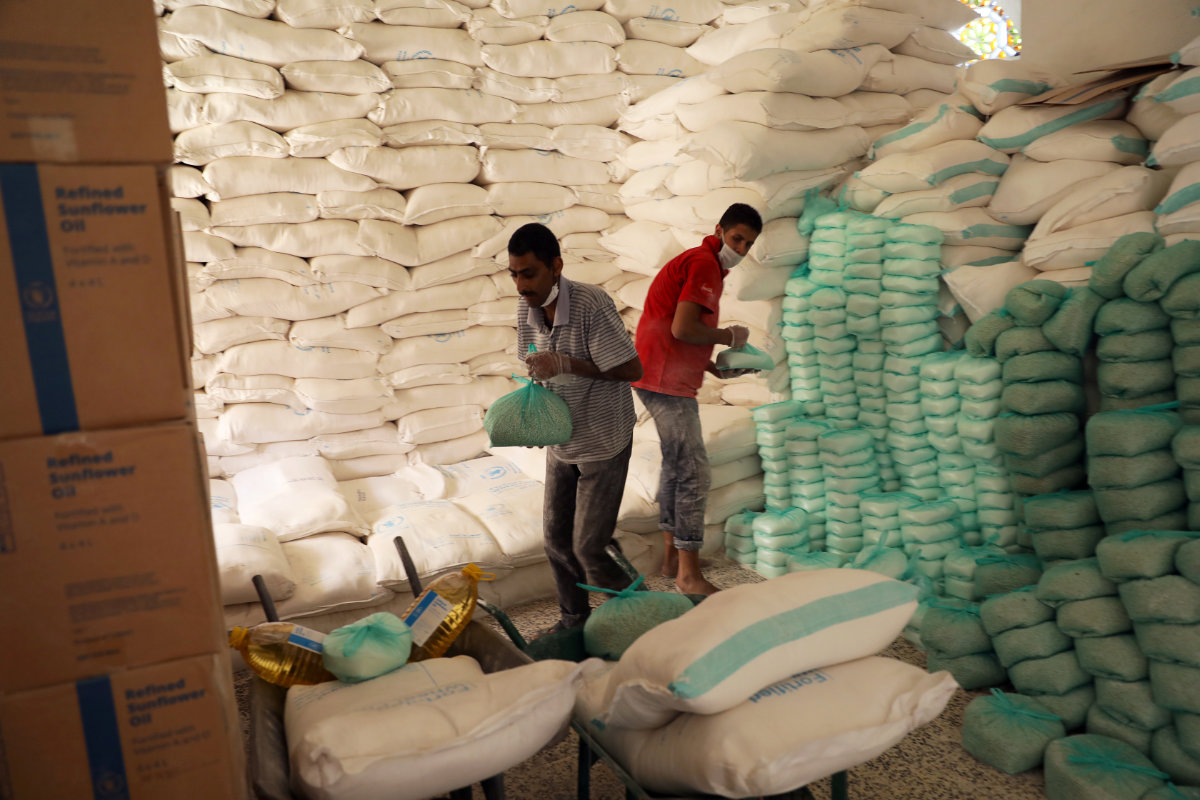 Workers prepare foodstuff for beneficiaries at a food distribution center supported by the World Food Program in Sanaa, Yemen, on June 3, 2020. (REUTERS/File Photo) Workers prepare foodstuff for beneficiaries at a food distribution center supported by the World Food Program in Sanaa, Yemen, on June 3, 2020. (REUTERS/File Photo)