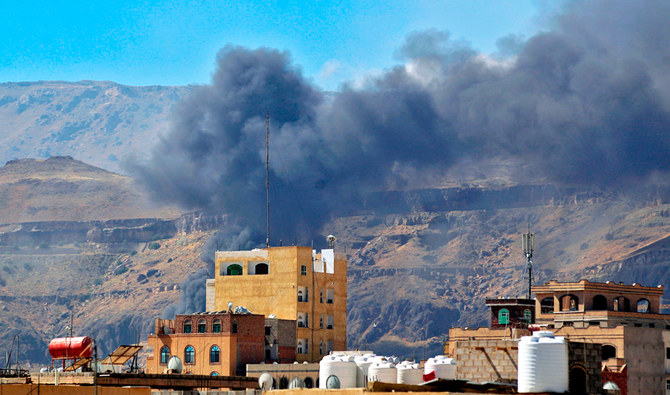 Smoke billows following a reported airstrike by the coalition in the Yemeni capital Sanaa, on November 27, 2020. (AFP)
