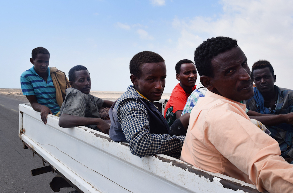 African migrants who were reportedly smuggled by sea into Yemen, sit on the back of a vehicle on the outskirts of the city of Aden. (AFP/File Photo) African migrants who were reportedly smuggled by sea into Yemen, sit on the back of a vehicle on the outskirts of the city of Aden. (AFP/File Photo)