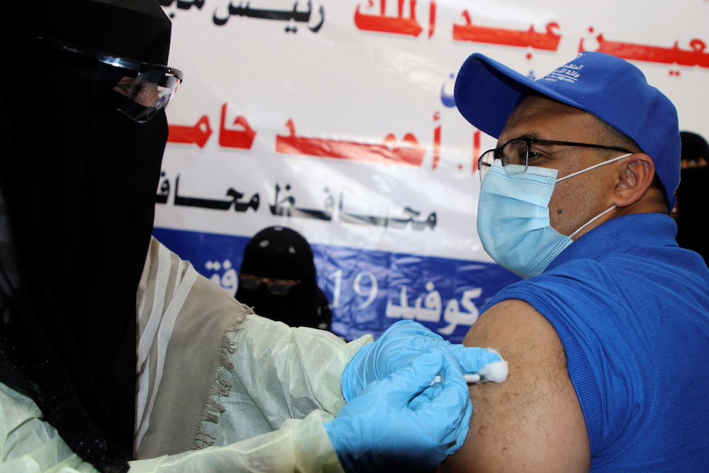 A health worker receives the AstraZeneca COVID-19 vaccine at a medical center in Aden, Yemen April 20, 2021. (Reuters) A health worker receives the AstraZeneca COVID-19 vaccine at a medical center in Aden, Yemen April 20, 2021. (Reuters)