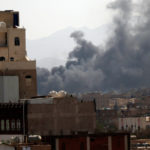 Smoke billows above the capital Sanaa following airstrikes by the Saudi-led coalition targeting Houthi-held military positions on March 7, 2021. (Mohammed Hamoud/Getty Images)